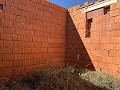 Grand terrain avec une construction incomplète in Real Estate Alicante