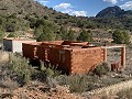Grand terrain avec une construction incomplète in Real Estate Alicante